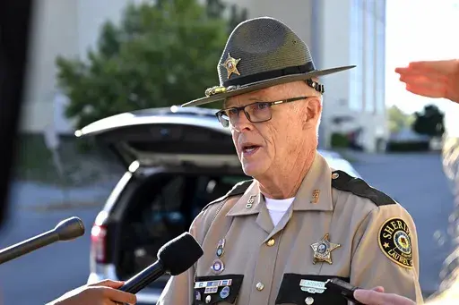 Deputy Gilbert Acciardo, Public information Officer with the Laurel County Sheriff's Office, gives details on the progress of the investigation of the shooting along I-75 in London, Ky., Sunday, Sept. 8, 2024. (AP Photo/Timothy D. Easley)