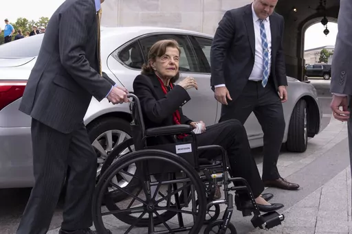 Sen. Dianne Feinstein, D-Calif., is assisted to a wheelchair by staff as she returns to the Senate after a more than two-month absence, at the Capitol in Washington, Wednesday, May 10, 2023. Feinstein’s office said Thursday, May 18, that she is suffering from Ramsay Hunt syndrome, a complication from the shingles virus that can paralyze part of the face, and that she contracted encephalitis while recovering from the virus earlier this year. (AP Photo/J. Scott Applewhite, File)