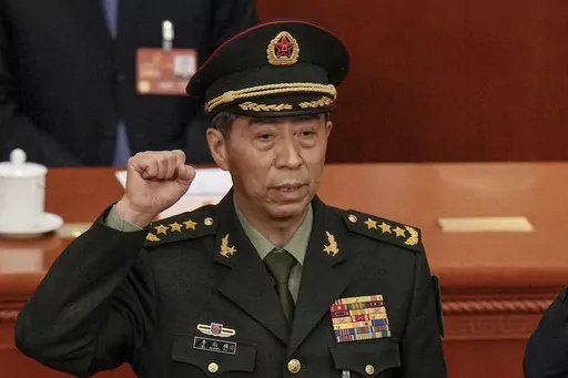 Newly elected Chinese Defense Minister Gen. Li Shangfu takes his oath during a session of China's National People's Congress (NPC) at the Great Hall of the People in Beijing on March 12, 2023. China has replaced Defense Minister Gen. Li, who has been out of public view for almost two months with little explanation, state media reported Tuesday, Oct. 24. (AP Photo/Andy Wong, File)