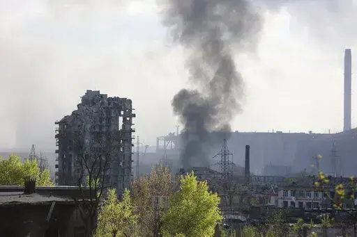 Smoke rises from the Azovstal steel mill in Mariupol, in territory under the government of the Donetsk People's Republic, eastern Ukraine, May 4, 2022. (AP Photo/Alexei Alexandrov, File)