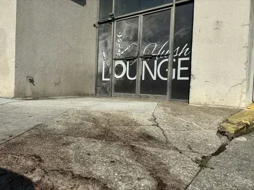 Blood stains were visible on the sidewalk outside of a nightclub in Birmingham, Ala. on Sunday, Sept. 22, 2024, after a mass shooting took place. (AP Photo/Kim Chandler)