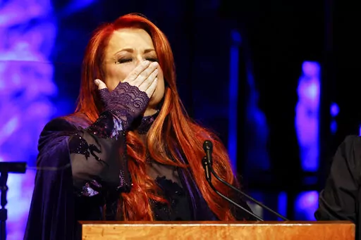 Wynonna Judd blows a kiss to attendees during the Medallion Ceremony at the Country Music Hall Of Fame Sunday, May 1, 2022, in Nashville, Tenn. (Photo by Wade Payne/Invision/AP)