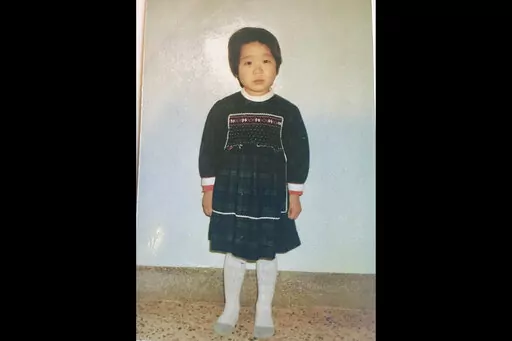 This undated photo provided by Joo-Rei Mathieson shows herself when she was in childhood taken in South Korea. A Brothers Home intake document describes Mathieson as a lost street kid brought in by police. It notes, chillingly for a government-sponsored vagrants' facility that survivors have told The Associated Press often worked children to death, that she's "capable of labor." She spoke no words for days, the document says, after entering Brothers, a now-destroyed facility in the southern port