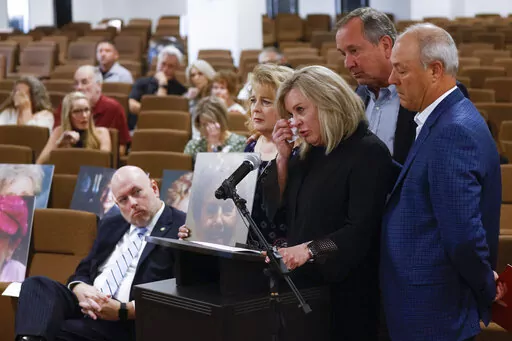 Ellen French House, center, daughter of victim Norma French, alongside her family members becomes emotional as she gives her victim impact statement  in accused killer Billy Chemirmir's trial at Frank Crowley Courts Building in Dallas on Friday, Oct. 14, 2022. Chemirmir, charged with killing 22 elderly women in the Dallas area over a two-year span, was found guilty last Friday, Oct. 7,  in one of their deaths — his second murder conviction. (Shafkat Anowar/The Dallas Morning News via AP)