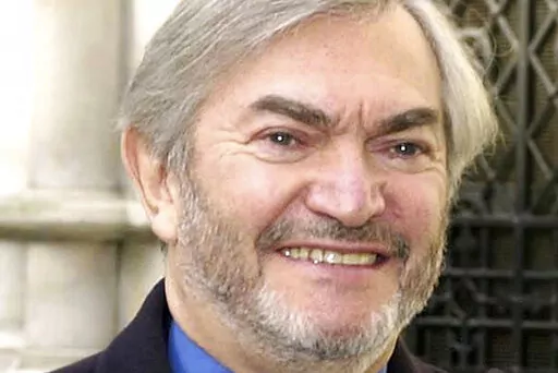 British composer Monty Norman is seen in this March 19, 2001 photo. Norman, who wrote the theme tune for the James Bond films, has died. He was 94. A statement posted Monday on Norman's official website said: "It is with sadness we share the news that Monty Norman died on 11th July 2022 after a short illness." (Kirsty Wigglesworth/PA via AP)