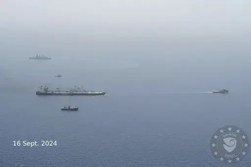 In this photo released of EUNAVFOR ASPIDES, the EU naval mission working in the Red Sea, on the X-platform formerly known as Twitter, on Sept. 16, 2024, the Greek-flagged oil tanker MV-Sounion, left, is towed. Salvagers successfully towed a Greek-flagged oil tanker ablaze for weeks after attacks by Yemen's Houthi rebels to a safe area without any oil spill, a European Union naval mission said Monday. (EUNAFOR ASPIDES via AP)