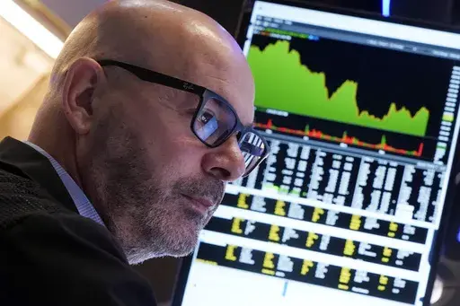 Trader Fred DeMarco works on the floor of the New York Stock Exchange, Wednesday, March 12, 2025. (AP Photo/Richard Drew)