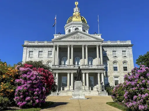 Rhododendrons bloom outside the New Hampshire Statehouse on Saturday, June 1, 2024, in Concord, N.H. On Thursday, June 13, the House killed legislation that would have legalized recreational use of marijuana, a step all other New England states have taken. (AP Photo/Holly Ramer)