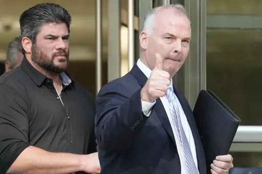 Michael McMahon gives photographers a thumbs up as he leaves Brooklyn Federal court, Wednesday, May 31, 2023, in New York. (AP Photo/Mary Altaffer)