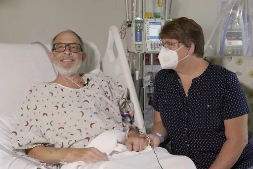 In this photo provided by the University of Maryland School of Medicine, Lawrence Faucette sits with wife, Ann, in the school's hospital in Baltimore, Md., in September 2023, before receiving a pig heart transplant. Lawrence Faucette, the second person to receive a transplanted heart from a pig has died, nearly six weeks after the highly experimental surgery, his doctors announced Tuesday, Oct. 31, 2023. (Mark Teske/University of Maryland School of Medicine via AP, File)