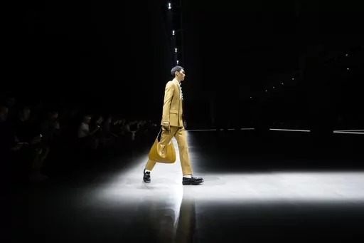A model wears a creation as part of the men's Gucci Fall-Winter 2024-2025 collection, that was presented in Milan, Italy, Friday, Jan. 12, 2024. (AP Photo/Luca Bruno).
