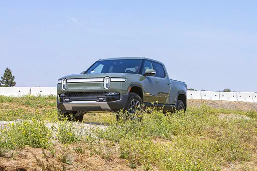 This photo, provided by Edmunds, shows the 2022 Rivian R1T. It is an all-electric pickup truck with an EPA-estimated range of 314 miles in its initial configuration. (Rex Tokeshi-Torres/Courtesy of Edmunds via AP)