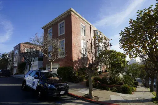 A San Francisco Police Department vehicle parks outside the home of Speaker of the House Nancy Pelosi, in San Francisco, Saturday, Oct. 29, 2022.  On Friday, Nov. 4, The Associated Press reported on stories circulating online incorrectly claiming the attack on Paul Pelosi was a “Domestic Violence Case in a consensual sexual relationship." (AP Photo/Jeff Chiu, File)