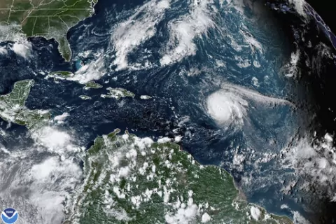 This satellite image provided by the National Oceanic and Atmospheric Administration shows Hurricane Sam, center right, in the Atlantic Ocean, Monday, Sept. 27, 2021, at 3:20 p.m. ET. On Tuesday, May 24, 2022, federal meteorologists say the Atlantic should expect another extra busy hurricane season in 2022. Tuesday's National Oceanic and Atmospheric Administration's Atlantic hurricane season forecast calls for 14 to 21 named storms, with six to 10 becoming hurricanes. (NOAA via AP, File)