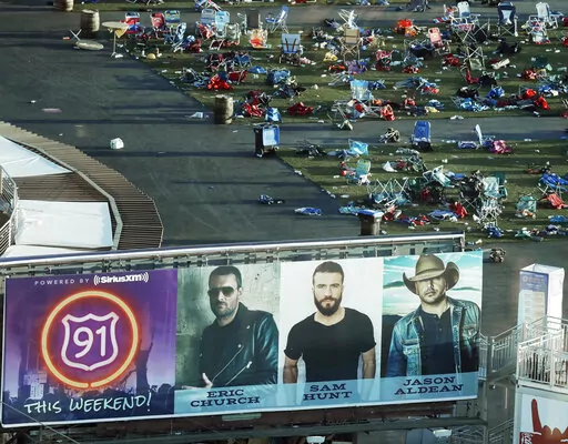 Personal belongings and debris litter the Route 91 Harvest festival grounds across the street from the Mandalay Bay resort and casino in Las Vegas on Oct. 3, 2017, after a mass shooting Oct. 1. A new documentary, “11 Minutes,” is an inside account of the 2017 massacre at a country music concert in Las Vegas. More than three hours long, the four-part documentary debuts on the Paramount+ streaming service Tuesday. (AP Photo/Marcio Jose Sanchez, File)