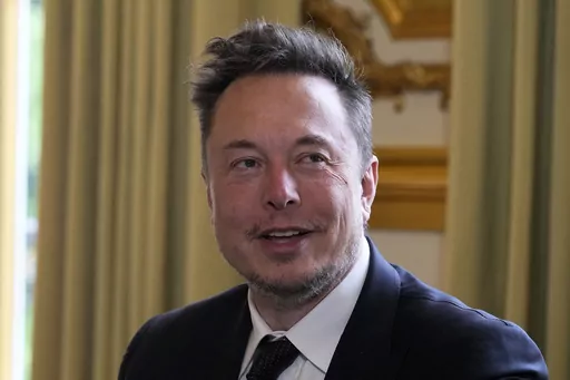Elon Musk poses prior to his talks with French President Emmanuel Macron, May 15, 2023 at the Elysee Palace in Paris. A federal appeals court says Musk cannot back out of a settlement with securities regulators over 2018 tweets claiming he had the funding to take Tesla private. The 2nd U.S. Circuit Court of Appeals in Manhattan ruled Monday, May 15, 2023 just days after hearing arguments from lawyers in the case. (AP Photo/Michel Euler, Pool), file