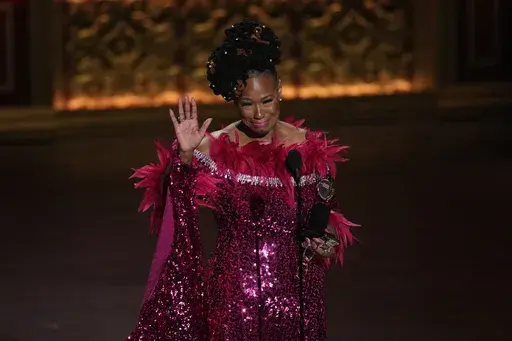 Kecia Lewis accepts the award for best performance by an actress in a featured role in a musical for "Hell's Kitchen" during the 77th Tony Awards on Sunday, June 16, 2024, in New York. (Photo by Charles Sykes/Invision/AP)