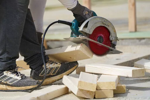A workman cuts sections of a bean at a housing site in Madison County, Miss., March 16, 2021. A general contractor who partners with a third-party lender to provide home improvement financing seems like a win-win: You get the renovation done by your contractor of choice, and it simplifies the question of how to pay for it. But contractors specialize in building and repairing, not financing, and they may not offer the best option. Loans through contractors are often unsecured personal loans, whic