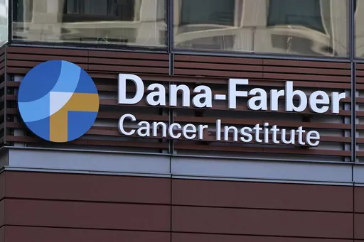 A sign hangs from the Dana-Farber Cancer Institute, Aug. 18, 2022, in Boston. Dana-Farber Cancer Institute announced it’s requesting six retractions and 31 corrections of scientific papers after a British blogger flagged problems in early January 2024. (AP Photo/Charles Krupa, File)