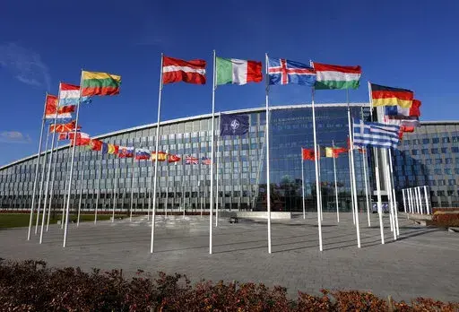 Flags flutter in the wind outside NATO headquarters in Brussels, Feb. 7, 2022. With Finland and Sweden taking steps to join NATO, the list of “neutral” countries in Europe appears poised to shrink. Security concerns over Russia’s ongoing invasion of Ukraine changed the calculus for Finland and Sweden which have long espoused neutrality and caused other traditionally “neutral” countries to re-think what that term really means for them. (AP Photo/Olivier Matthys, File)