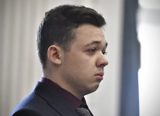 Kyle Rittenhouse keeps his composure while starting to cry as he is found not guilty on all counts on Nov. 19, 2021, at the Kenosha County Courthouse in Kenosha, Wis. A federal judge in Wisconsin on Wednesday, Feb. 1, 2023, ruled that a civil rights wrongful death lawsuit filed by the father of a man shot and killed by Rittenhouse during a protest in 2020 can proceed against city officials, police officers, Rittenhouse and others. (Sean Krajacic/The Kenosha News via AP, Pool, File)