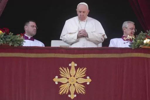 Pope Francis delivers the Urbi et Orbi (Latin for 'to the city and to the world' ) Christmas' day blessing from the main balcony of St. Peter's Basilica at the Vatican, Sunday, Dec. 25, 2022. (AP Photo/Gregorio Borgia)