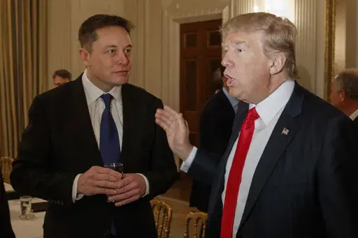 President Donald Trump, right, talks with Tesla and SpaceX CEO Elon Musk at the White House in Washington, Feb. 3, 2017. (AP Photo/Evan Vucci, File)