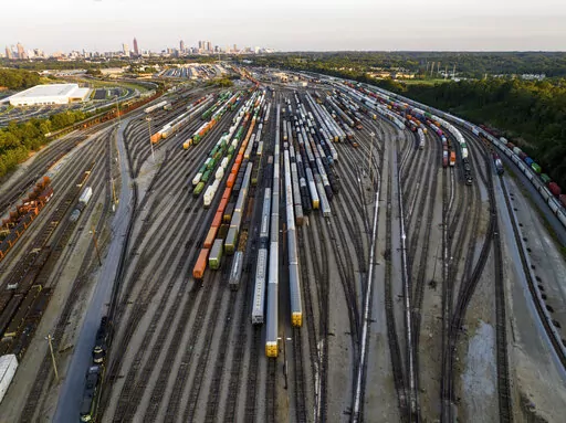 Freight train cars sit in a Norfolk Southern rail yard on Sept. 14, 2022, in Atlanta. Business groups are increasing the pressure on lawmakers to intervene and block a railroad strike before next month's deadline in the stalled contract talks. A coalition of more than 400 business groups sent a letter to Congressional leaders Monday, Nov. 28, 2022 urging them to step in because of fears about the devastating potential impact of a strike that could force many businesses to shut down. (AP Photo/Da