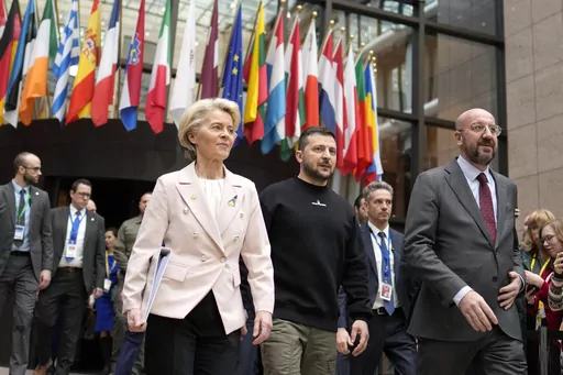 From left, European Commission President Ursula von der Leyen, Ukraine's President Volodymyr Zelenskyy and European Council President Charles Michel walk together during an EU summit in Brussels on Feb. 9, 2023. The European Union decided Thursday, Dec. 14, 2023 to open accession negotiations with Ukraine, a stunning reversal for a country at war that had struggled to find the necessary backing for its membership aspirations and long faced opposition from Hungarian Prime Minister Viktor Orban. (