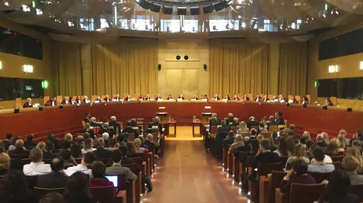 Judges preside over a hearing at the European Court of Justice in Luxembourg on Nov. 27, 2018. The European Union's highest court ruled on Wednesday, Feb. 16, 2022 that the 27-nation bloc can link financial backing for member states to respect for rule of law and that a challenge by Hungary and Poland should be dismissed. (AP Photo/Sylvain Plazy, File)