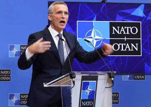 NATO Secretary General Jens Stoltenberg speaks during a media conference after an extraordinary meeting of NATO Ministers of Foreign Affairs via video link at NATO headquarters, in Brussels, Friday, Jan. 7, 2022. NATO foreign ministers on Friday discussed Russia's military build-up around Ukraine amid skepticism about the credibility of President Vladimir Putin's offer to ease tensions, ahead of a week of high-level diplomacy aimed at ending the standoff. (AP Photo/Olivier Matthys)