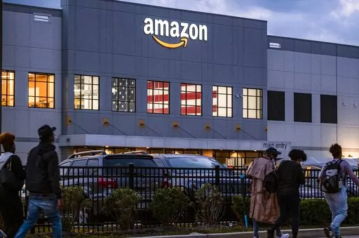 People arrive for work at the Amazon distribution center in the Staten Island borough of New York, on Oct. 25, 2021. Amazon plans to file objections to the union election on Staten Island, N.Y., that resulted in the first successful U.S. organizing effort in the company’s history. The e-commerce giant stated its plans in a legal filing to the National Labor Relations Board made public Thursday, April 7, 2022. (AP Photo/Craig Ruttle, File)