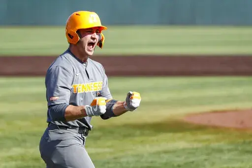 FILE -Tennessee outfielder Evan Russell (6) reacts to hitting a home run during an NCAA college baseball super regional game against LSU Sunday, June 13, 2021, in Knoxville, Tenn. Tennessee's Evan Russell has been cleared to play in an NCAA Tournament regional game against Campbell on Saturday, June 4, 2022 and the school said it expects an apology from ESPN after one of its announcers said the catcher had failed a test for performance enhancing drugs.(AP Photo/Wade Payne, File)