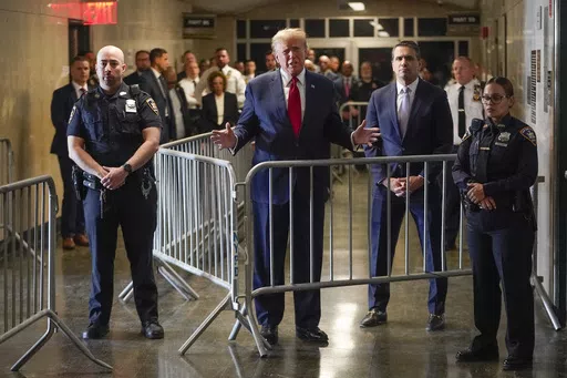 Former President Donald Trump speaks before entering the courtroom at Manhattan criminal court, Thursday, Feb. 15, 2024, in New York. A dozen Manhattan residents are soon to become the first Americans ever to sit in judgment of a former president charged with a crime. Jury selection is set to start Monday in former President Donald Trump's hush-money trial. (AP Photo/Mary Altaffer, File)