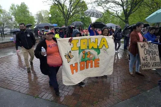 People march during an Iowa Movement for Migrant Justice rally and march, Wednesday, May 1, 2024, in Des Moines, Iowa. A federal judge on Monday temporarily blocked an Iowa law that allows law enforcement in the state to file criminal charges against people with outstanding deportation orders or those who previously had been denied entry to the United States. (AP Photo/Charlie Neibergall, File)