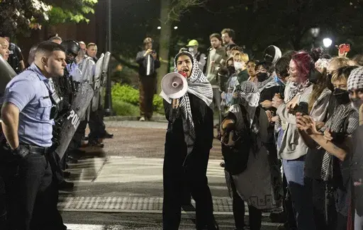 Pro-Palestinian protesters and Philadelphia police have a standoff along 34th Street at the University of Pennsylvania on Friday, May 17, 2024. Authorities say a half-dozen University of Pennsylvania students were among 19 pro-Palestinian protesters arrested during an attempt to occupy a building on campus. University police say seven remained in custody Saturday awaiting felony charges from Friday's incident, including one person who allegedly assaulted an officer. (Charles Fox/The Philadelphia