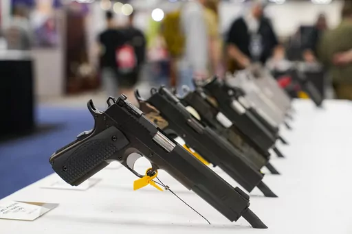 An array of pistols are shown in the Dan Wesson display as guests browse firearms at the National Rifle Association's Annual Meetings & Exhibits in Indianapolis, April 16, 2023. The roster of Republican presidential hopefuls who flocked to the National Rifle Association's annual convention reflects the political potency of gun rights, despite the group's eroding revenues and an opposition movement that's growing increasingly vocal as the drumbeat of mass shootings marches on.(AP Photo/Michael Co