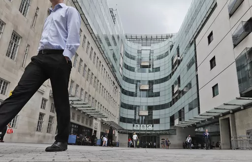 A view of the main entrance to the headquarters of the publicly funded BBC in London, Wednesday, July 19, 2017. Senior British politicians on Sunday, July 9, 2023 called on the BBC to rapidly investigate a complaint that a leading presenter paid a teenager for explicit photos. The publicly funded national broadcaster is under pressure after The Sun newspaper reported allegations that the male presenter gave a youth 35,000 pounds ($45,000) starting in 2020 when the young person was 17. (AP Photo/