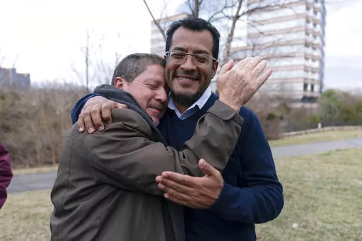 Nicaraguan opposition leader Felix Maradiaga is welcomed by a supporter in Chantilly, Va., Thursday, Feb. 9, 2023. Maradiaga was among some 222 prisoners of the government of Nicaraguan President Daniel Ortega who arrived from Nicaragua to the Washington Dulles International Airport on Thursday, after an apparently negotiated release. (AP Photo/Jose Luis Magana)