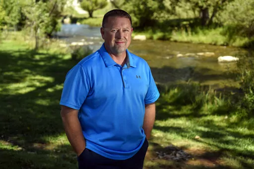 Shaun Nielsen stands for a portrait in Sioux Park in Rapid City, S.D. Nielsen, a middle-school social studies teacher in the Rapid City Area School District, was part of a commission formed to help develop new social studies standards in South Dakota. Nielsen said before the group began its work, he got a thick packet of materials from Hillsdale College, a conservative Michigan school, that ultimately formed what the state's public schools students could be expected to learn about American histo