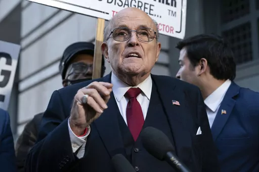 Former Mayor of New York Rudy Giuliani speaks during a news conference outside the federal courthouse in Washington, Friday, Dec. 15, 2023. A jury awarded $148 million in damages on Friday to two former Georgia election workers who sued Giuliani for defamation over lies he spread about them in 2020 that upended their lives with racist threats and harassment. (AP Photo/Jose Luis Magana, File)