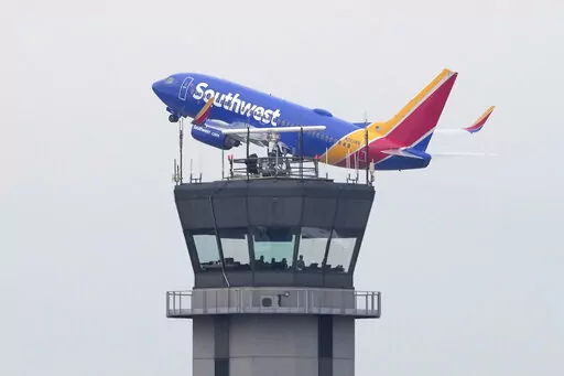 A Southwest Airlines passenger jet takes off from Chicago's Midway Airport as flight delays stemming from a computer outage at the Federal Aviation Administration brought departures to a standstill across the U.S earlier Wednesday, Jan. 11, 2023, in Chicago. (AP Photo/Charles Rex Arbogast)