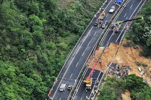 In this photo released by Xinhua News Agency, an aerial photo shows rescuers work at the site of a collapsed road section of the Meizhou-Dabu Expressway in Meizhou, south China's Guangdong Province, Wednesday, May 1, 2024. A section of a highway collapsed early Wednesday in southern China leaving more than a dozen of people dead, local officials said, after the area had experienced heavy rain in recent days. (Xinhua News Agency via AP)