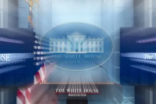In this photo made with a slow shutter speed, the White House podium is seen before a briefing in the James Brady Press Briefing Room at the White House, March 5, 2025, in Washington. (AP Photo/Alex Brandon, File)