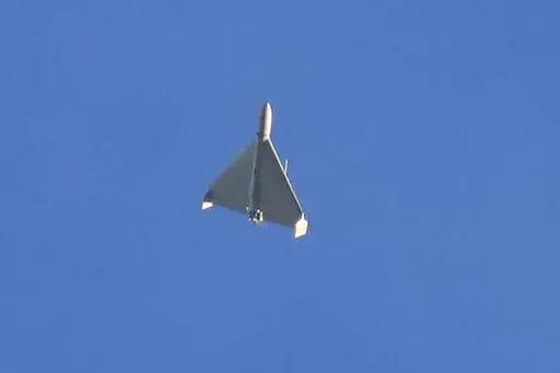 A drone is seen in the sky seconds before it fired on buildings in Kyiv, Ukraine, Monday, Oct. 17, 2022. (AP Photo/Efrem Lukatsky)