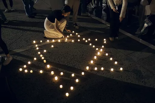 Rutgers University's students place candles with the Star of David pattern to hold solidarity and vigil for Israel on Wednesday, Oct. 25, 2023, in New Brunswick, N.J. For many of the university chaplains and faith leaders caring for students angered and shaken by the Israel-Hamas war, the needs are acute, the days intense. The bloodshed has roiled campuses in the United States, sparking rival rallies and competing demands.(AP Photo/Andres Kudacki)