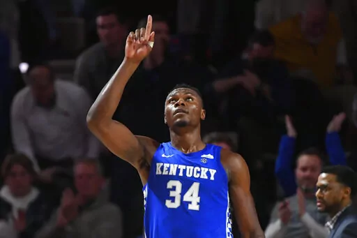 Kentucky forward Oscar Tshiebwe (34) as after an NCAA college basketball game against Vanderbilt comes to an end, Tuesday, Jan. 11, 2022, in Nashville, Tenn. Kentucky won 78-66. (AP Photo/John Amis)