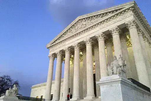 The Supreme Court at sunset in Washington, Feb. 13, 2016. (AP Photo/Jon Elswick, File)