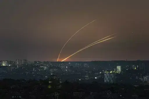 Russian rockets are launched against Ukraine from Russia's Belgorod region, seen from Kharkiv, Ukraine, on Thursday, April 18, 2024. (AP Photo/Evgeniy Maloletka)
