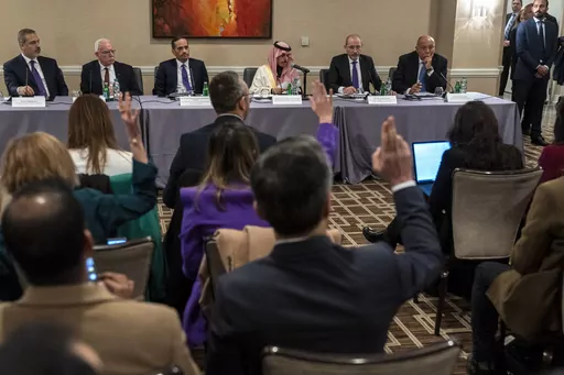 Reporters raise their hands to ask questions as Foreign Ministers, from left, Turkish Foreign Minister Hakan Fidan, Palestinian Minister of Foreign Affairs Riyad al-Maliki, Qatari Prime Minister and Minister of Foreign Affairs Sheikh Mohammed bin Abdulrahman bin Jassim Al-Thani, Saudi Foreign Minister Prince Faisal bin Farhan, Jordan's Minister of Foreign Affairs Ayman Safadi, and Egyptian Foreign Affairs Minister Sameh Shoukry, attend a news conference about the Israel-Hamas war, and pressure t